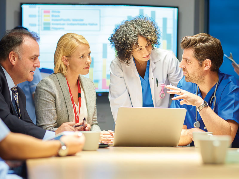 group of healthcare professionals working around a table