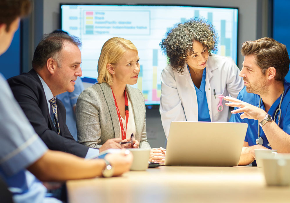 group of healthcare professionals working around a table