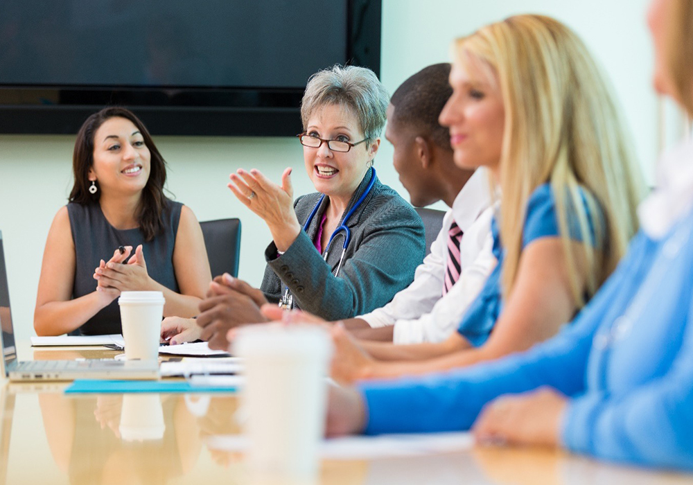 Nurses at a board table