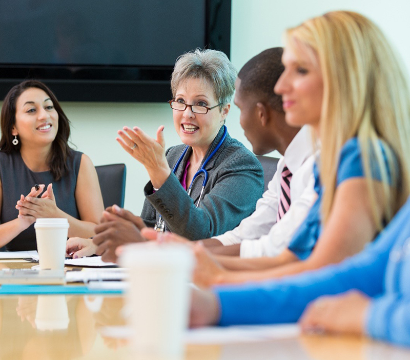 Nurses at a board table