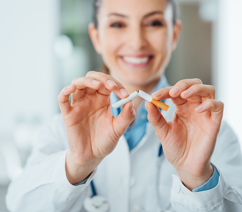 Female healthcare provider breaking a cigarette