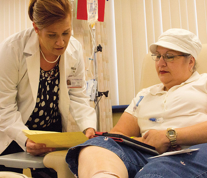 Oncology patient with her treating nurse