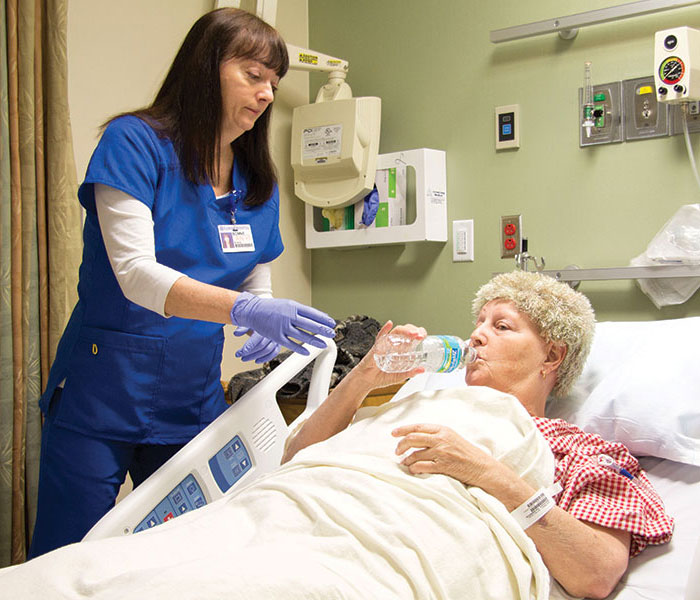 An oncology nurse promotes oral adherence