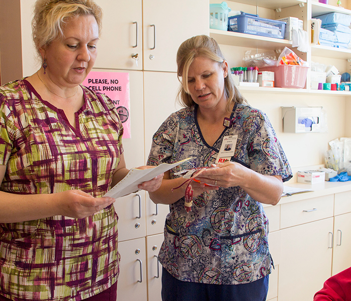 Nurse ordering chemotherapy treatment